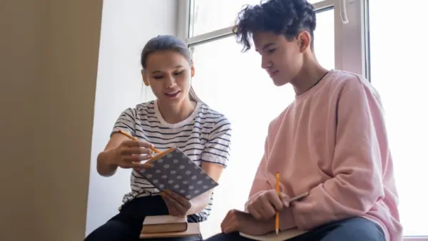 therapist explaining How Long Does an Intensive Outpatient Program Last for Teenagers