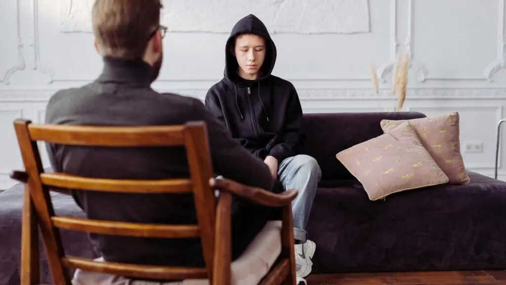 Teen participating in individual therapy for substance use recovery