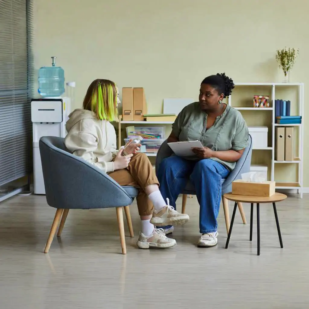 A therapist explaining the benefits of intervention services in New Jersey A therapist explaining the benefits of intervention services in New Jersey