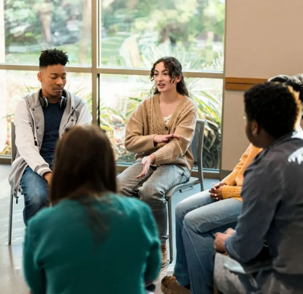 Teens participating in group therapy session for addiction recovery in New Jersey Teens participating in group therapy session for addiction recovery in New Jersey