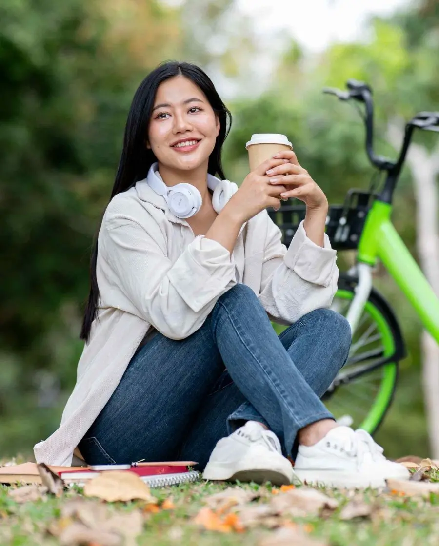 A teen relaxing at the park while applying coping skills from her relapse prevention program A teen relaxing at the park while applying coping skills from her relapse prevention program