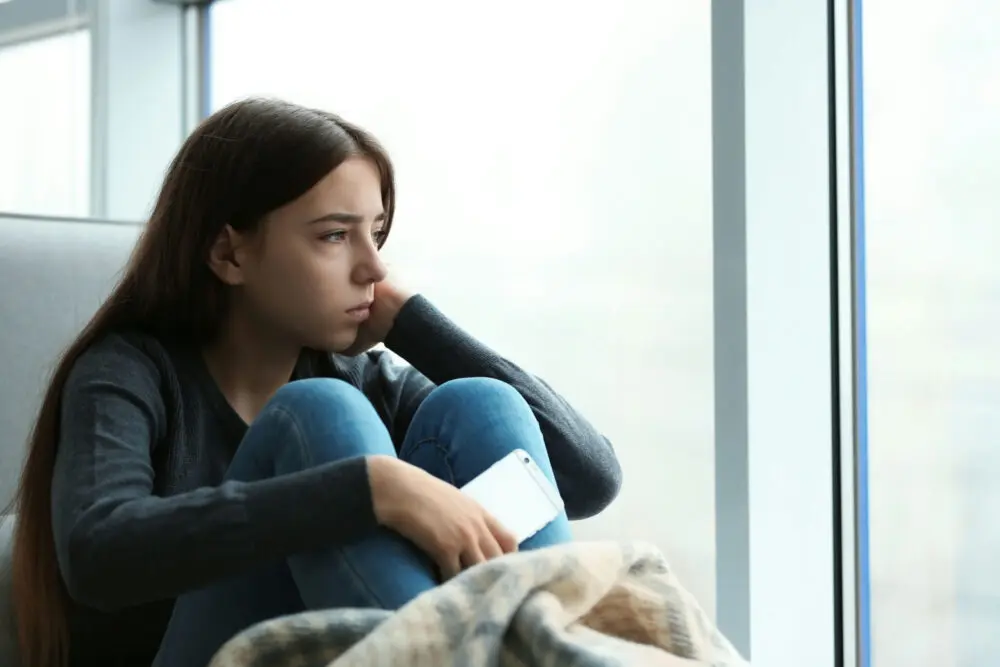 causes-of-teen-stress teen girl struggling with school-related stress