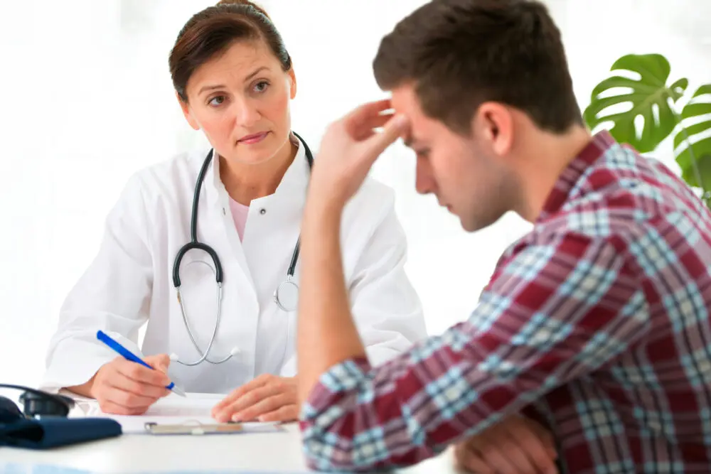 common-causes-of-stress-in-teens therapist helping teen boy manage everyday stress
